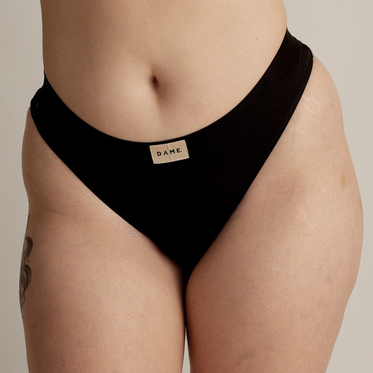 Thong Period Pant from 4 Pack Bundle by DAME in black, made with soft organic cotton and leak-proof layers for eco-friendly period protection.