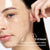 Woman applying Bio Collagen Face Mask for overnight hydration and rejuvenation. Promotes glowing skin with deep moisture and brightening effects.