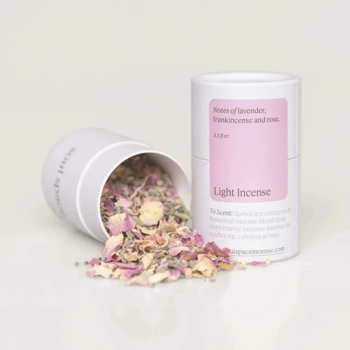 Light Incense Frankincense & Rose botanical incense blend in a white and pink cylindrical container with dried floral mix for calming home fragrance.