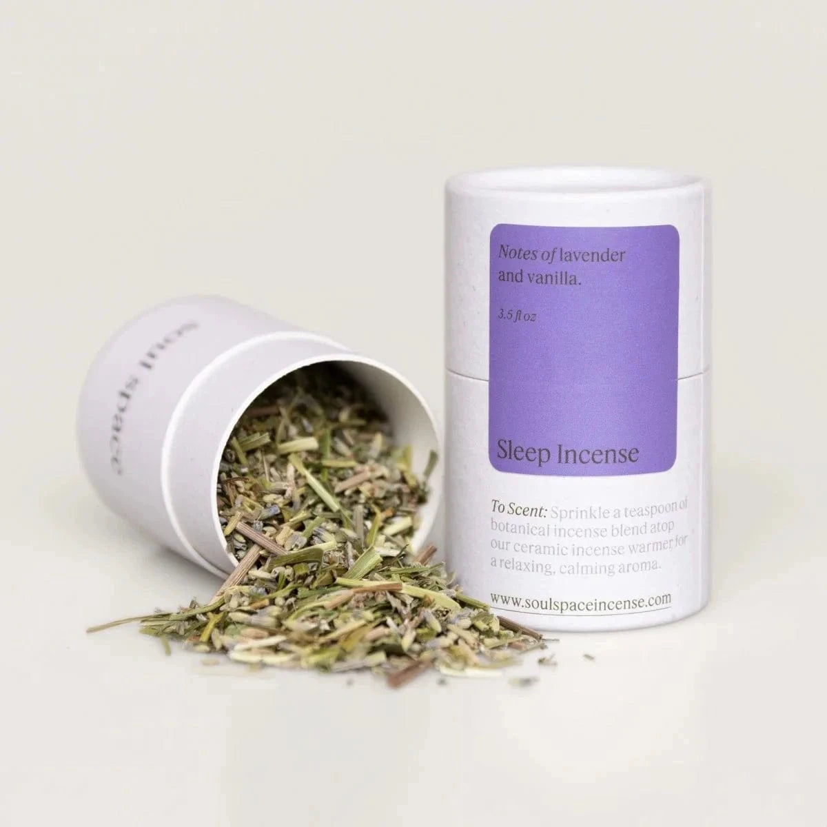 Sleep Incense Sweetgrass Lavender blend in white cylindrical container with dried herbs spilling out, ideal for restful sleep and stress relief.